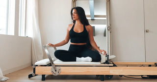 Woman in black TENCEL leggings and sports bra at the gym