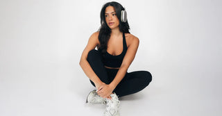 Woman in black TENCEL leggings and sports bra at the gym