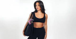 Woman in black TENCEL leggings and sports bra at the gym